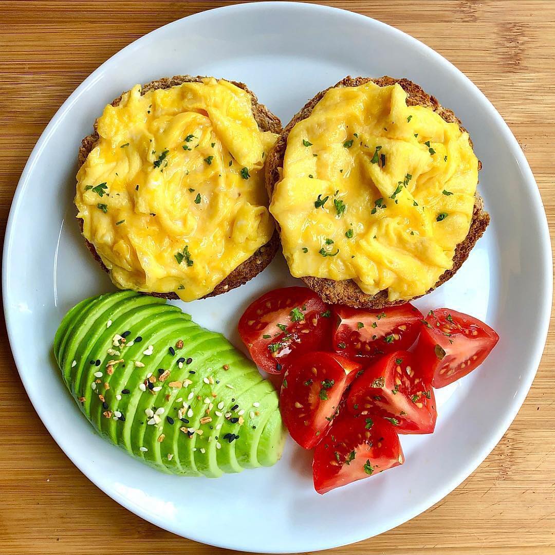 sprouted grain english muffin roasted and topped with garlic ghee and creamy scr…