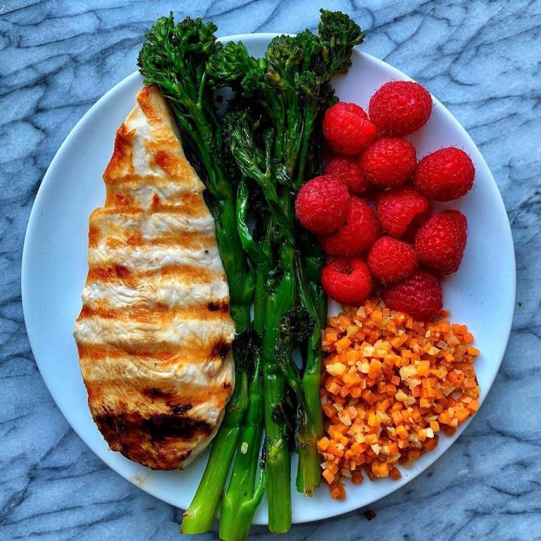 grilled chicken with all my favorite sides: roasted broccolini, sweet potato cauliflower rice and raspberries