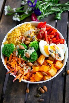 Rainbow Buddha Bowl with Sweet Potatoes, Lentils, Broccoli and Tahini Dressing Rainbow Buddha Bowl with Sweet Potatoes, Lentils, Broccoli and Tahini Dressing