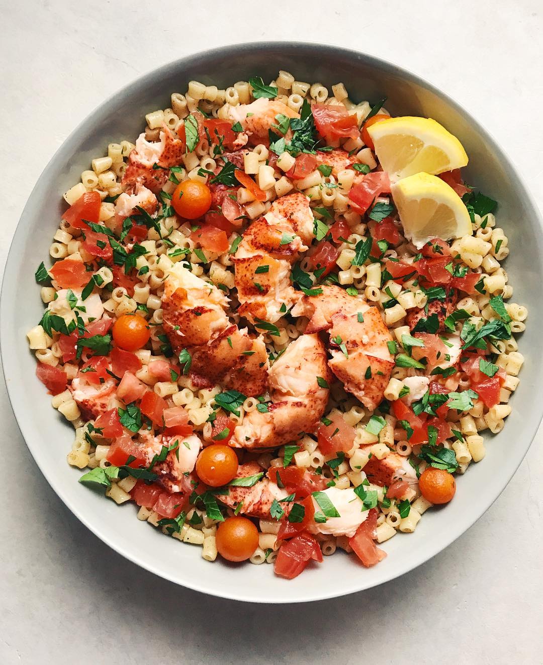 Brown butter lobster pasta with some super sweet sungolds, minced tomato, garlic… Brown butter lobster pasta with some super sweet sungolds, minced tomato, garlic…